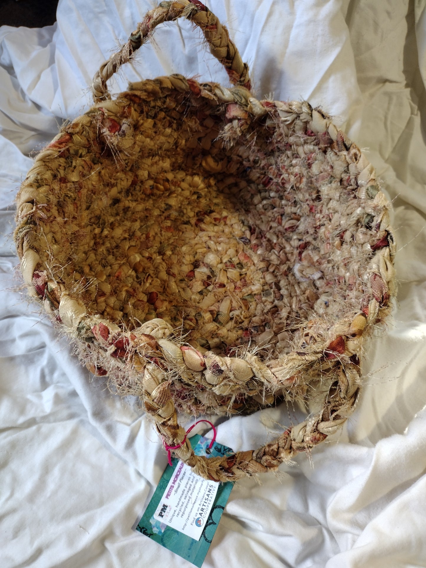 Baskets: 12 inch diameter hand braided basket with handles