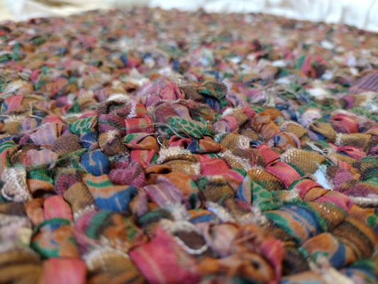 Rugs: 2 ft hand braided oval rug