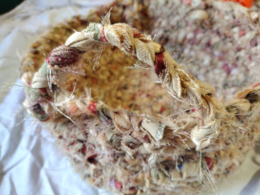 Baskets: 12 inch diameter hand braided basket with handles