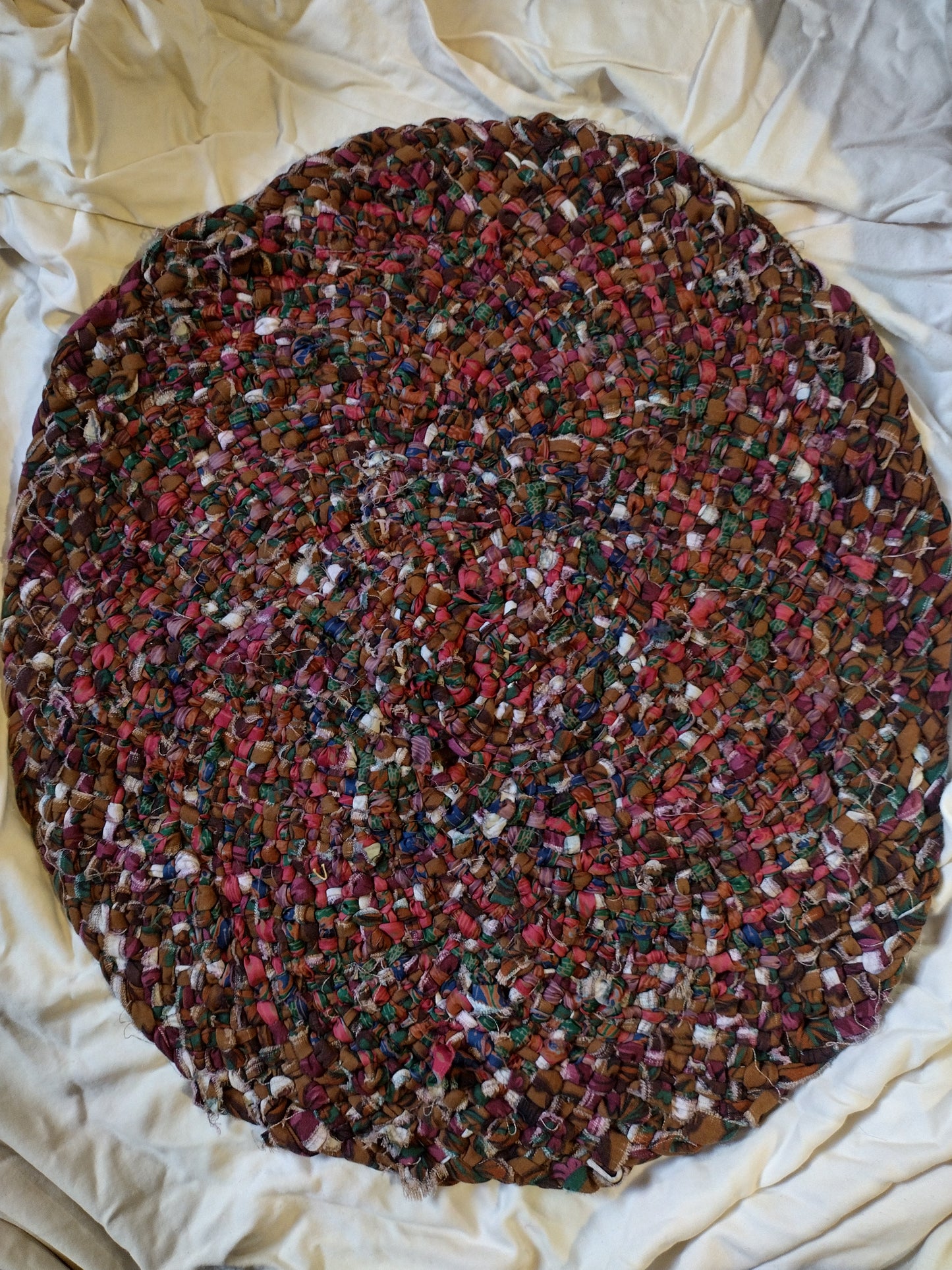 Rugs: 2 ft hand braided oval rug