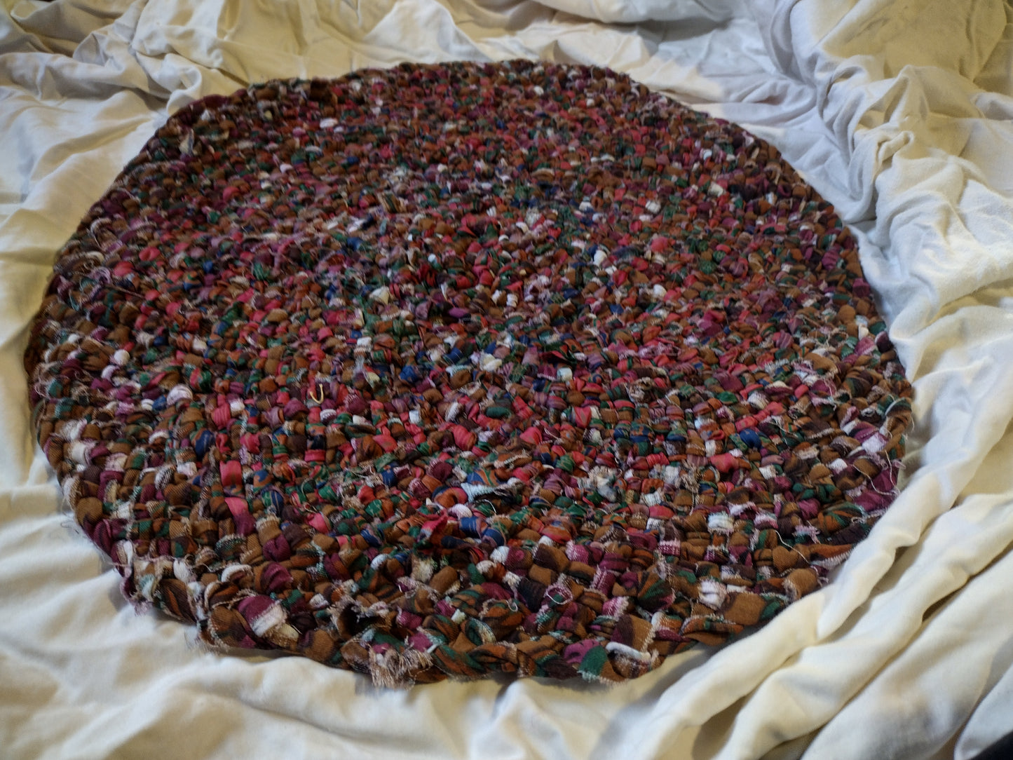 Rugs: 2 ft hand braided oval rug