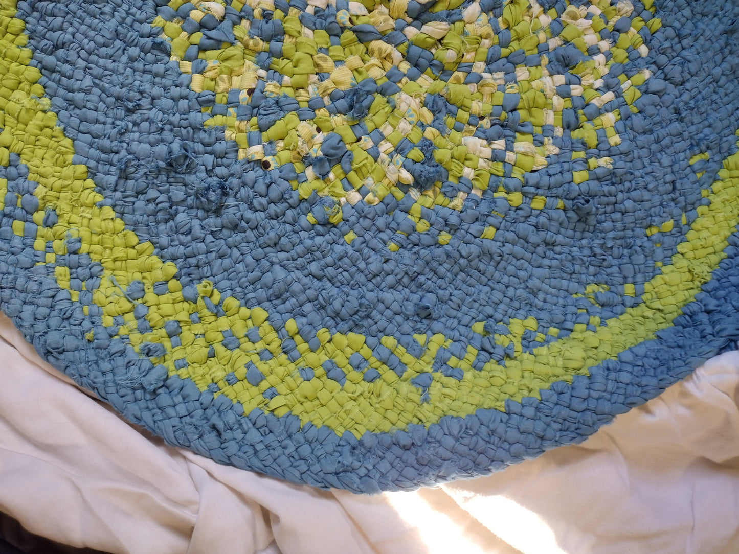 Rugs: 2 foot 3 inch hand braided round rug